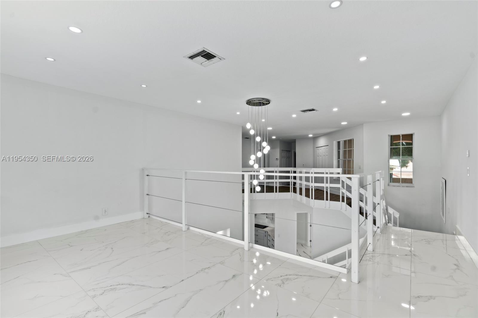 6357 Brava Way, Unit 6357 Boca Raton, FL 33433 - Photo 10 of 45 An eleveated space that adds dimension, light, and endless possibilities to the heart of the home.