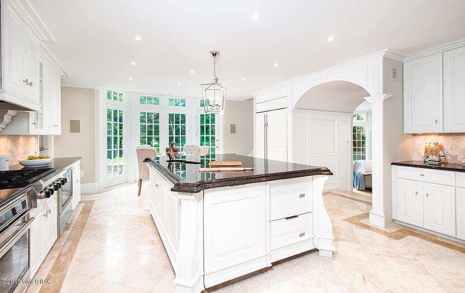 2 Round Hill Road Greenwich, CT 06831 - Photo 11 of 34 a kitchen with granite countertop a sink stove and cabinets