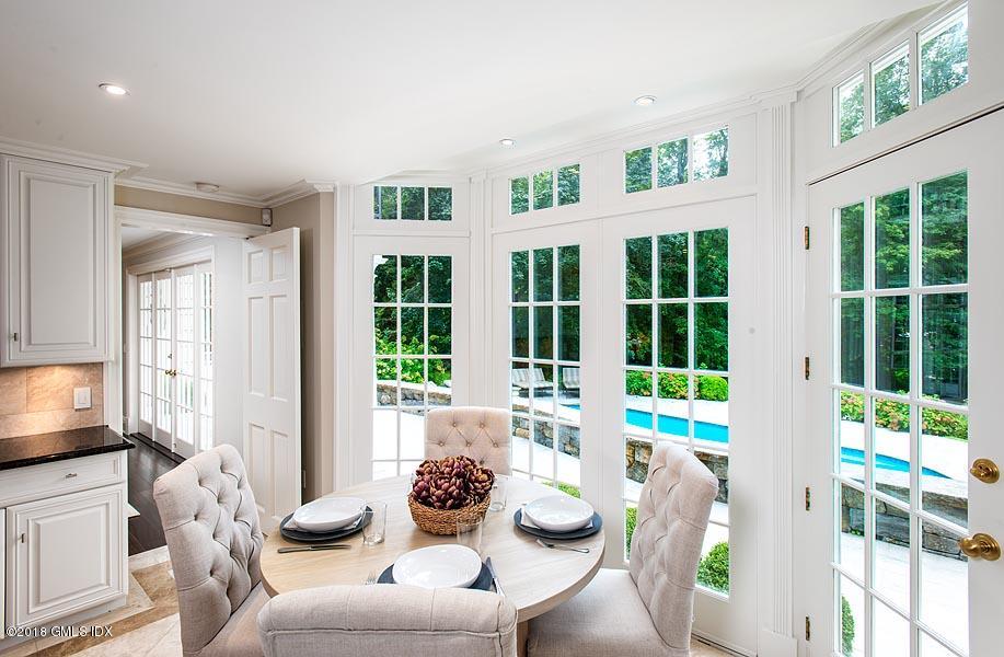2 Round Hill Road Greenwich, CT 06831 - Photo 12 of 34 a living room with furniture and floor to ceiling windows