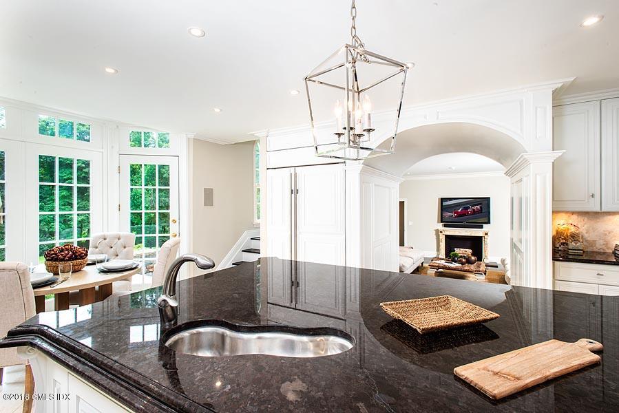 2 Round Hill Road Greenwich, CT 06831 - Photo 13 of 34 a living room with furniture and a chandelier