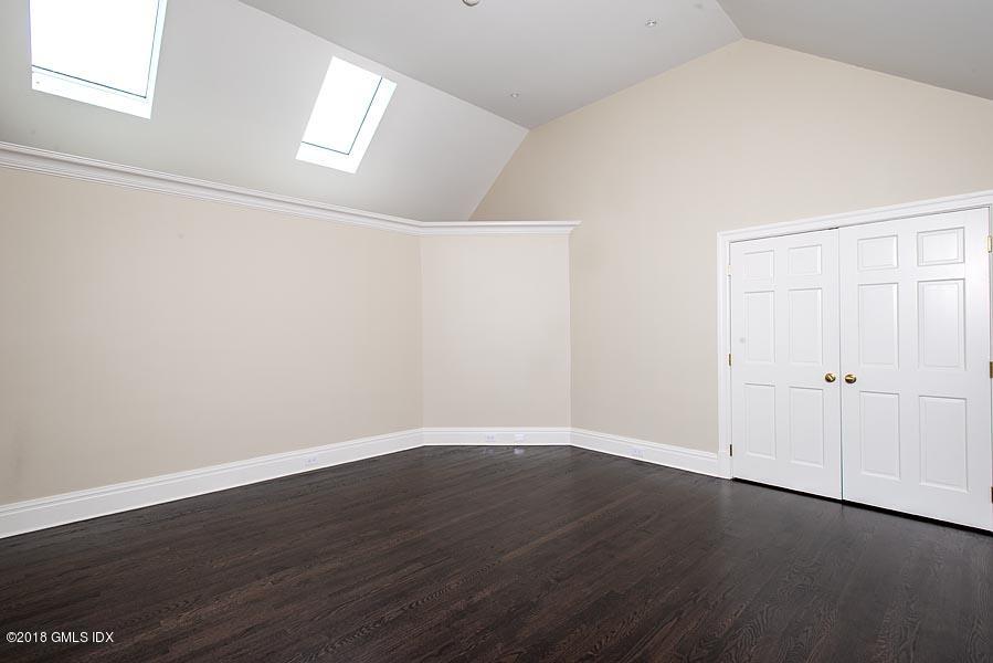 2 Round Hill Road Greenwich, CT 06831 - Photo 25 of 34 a view of an empty room with wooden floor