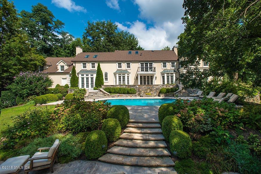 2 Round Hill Road Greenwich, CT 06831 - Photo 29 of 34 a front view of a house with a yard