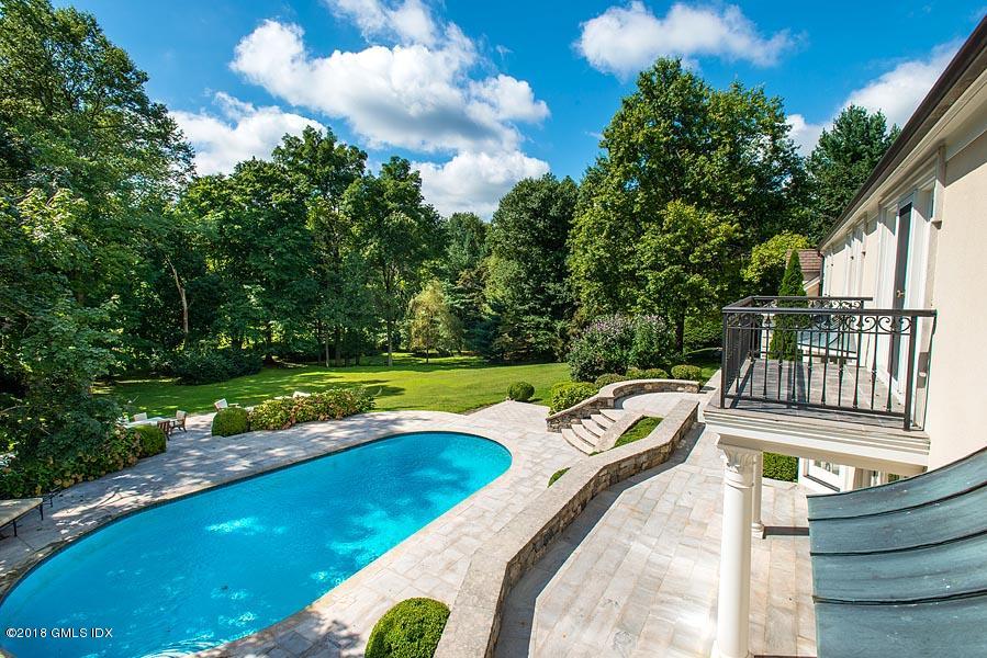 2 Round Hill Road Greenwich, CT 06831 - Photo 31 of 34 a view of a swimming pool with a patio