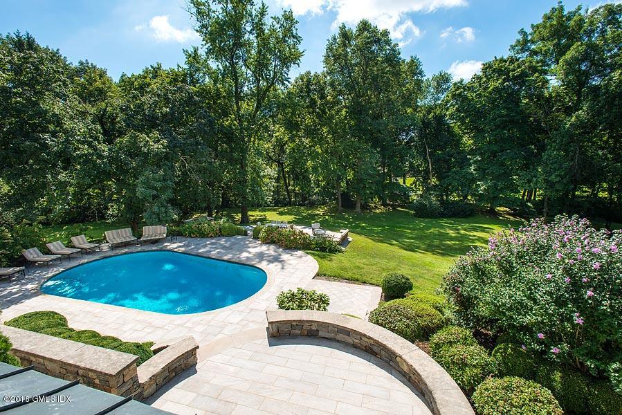 2 Round Hill Road Greenwich, CT 06831 - Photo 32 of 34 a view of a swimming pool and a yard