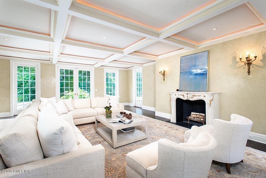 2 Round Hill Road Greenwich, CT 06831 - Photo 5 of 34 a living room with furniture a fireplace and a large window