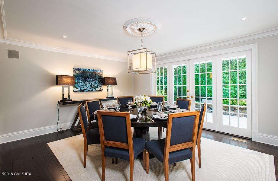 2 Round Hill Road Greenwich, CT 06831 - Photo 6 of 34 a dining room with furniture a chandelier and wooden floor