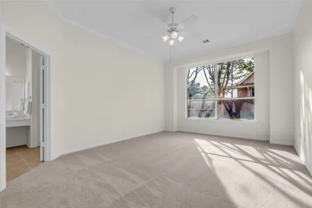 a bathroom with a double vanity sink mirror and bathtub