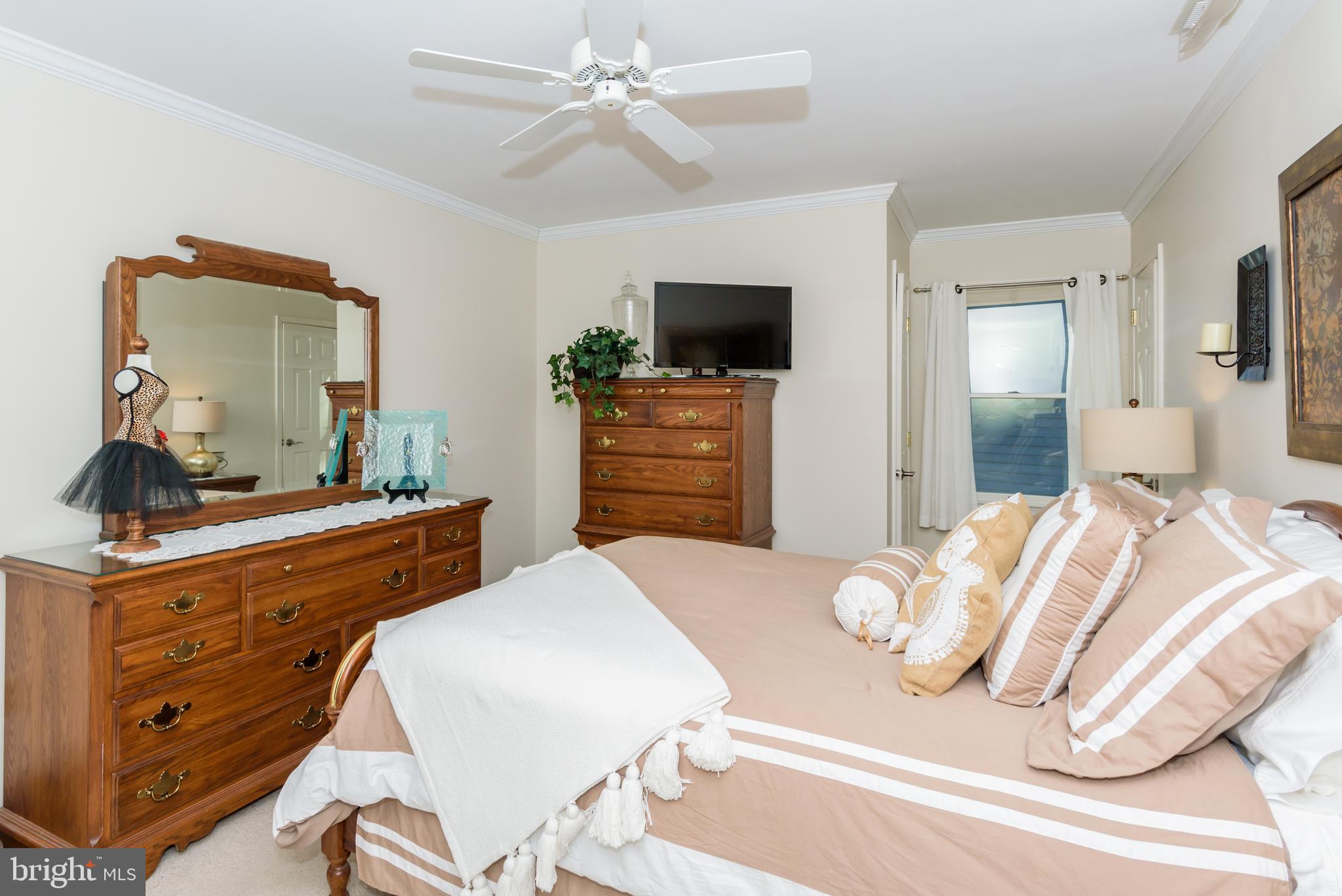 11 Drawbridge Road Berlin, MD 21811 - Photo 40 of 78 a bedroom with a bed and a television
