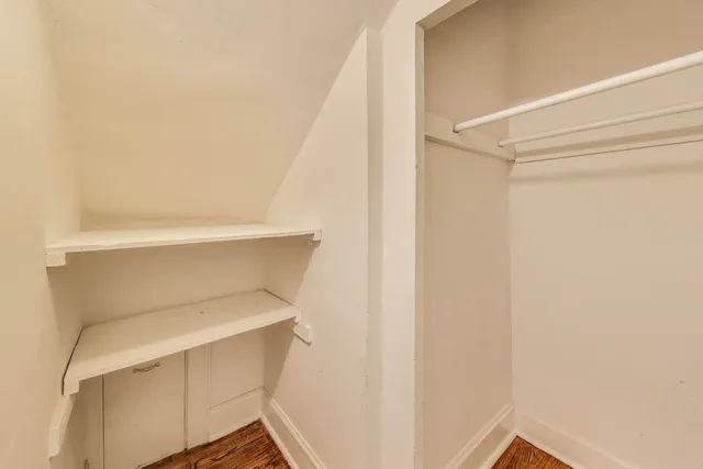 a bathroom with a sink a toilet and shower curtain