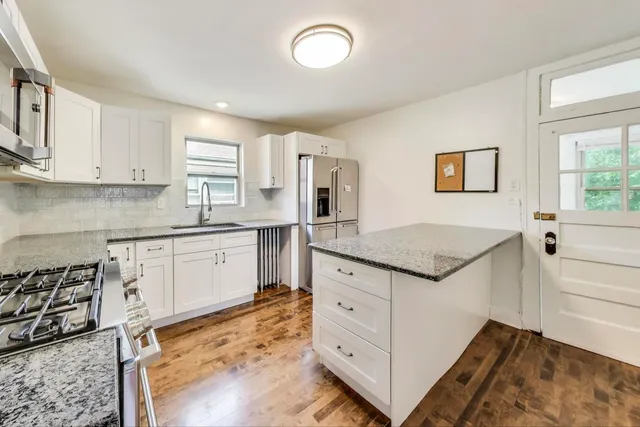 a view of walk in closet and window