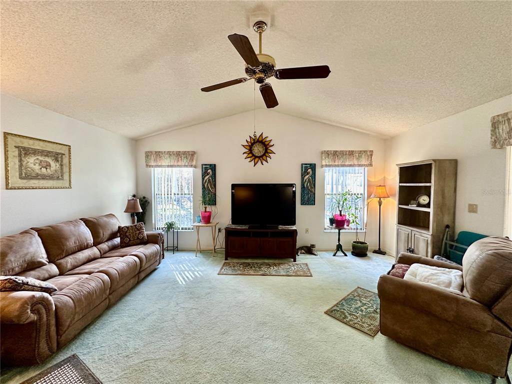 262 Santa Rosa Drive Winter Haven, FL 33884 - Photo 13 of 40 a living room with furniture and a flat screen tv