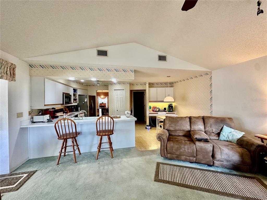 262 Santa Rosa Drive Winter Haven, FL 33884 - Photo 16 of 40 a living room with furniture and a flat screen tv