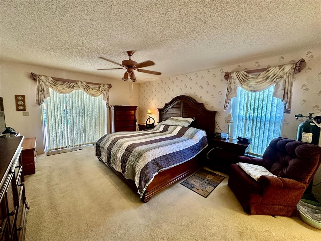 262 Santa Rosa Drive Winter Haven, FL 33884 - Photo 18 of 40 a bedroom with a bed couch and window