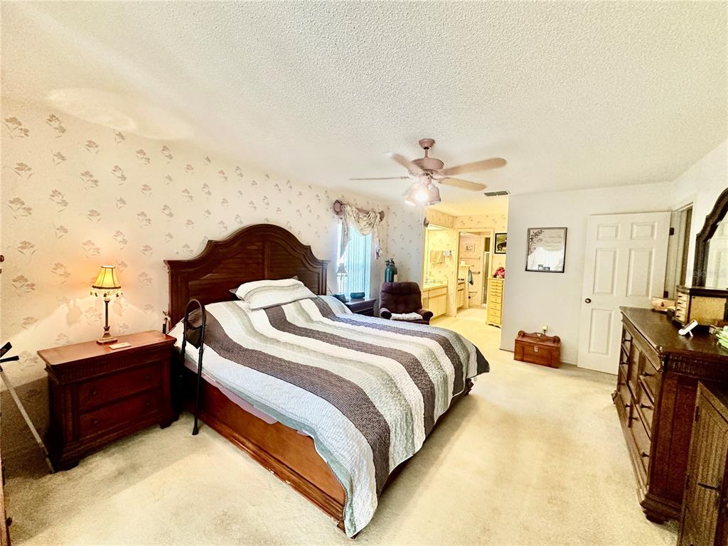 262 Santa Rosa Drive Winter Haven, FL 33884 - Photo 20 of 40 a bedroom with bed and a night stand