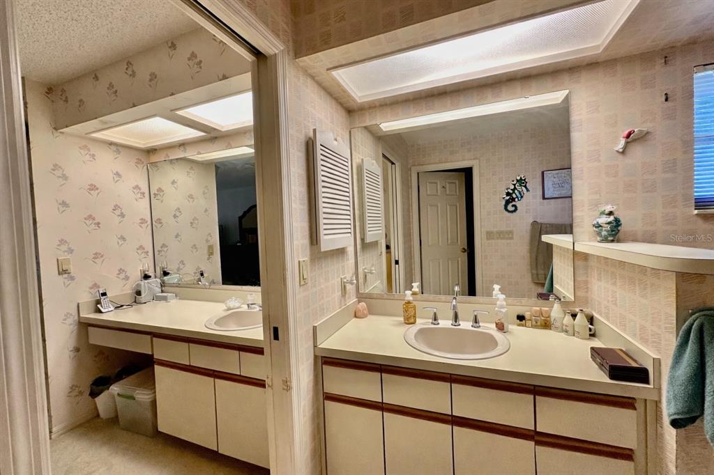 262 Santa Rosa Drive Winter Haven, FL 33884 - Photo 23 of 40 a bathroom with a sink double vanity and a mirror