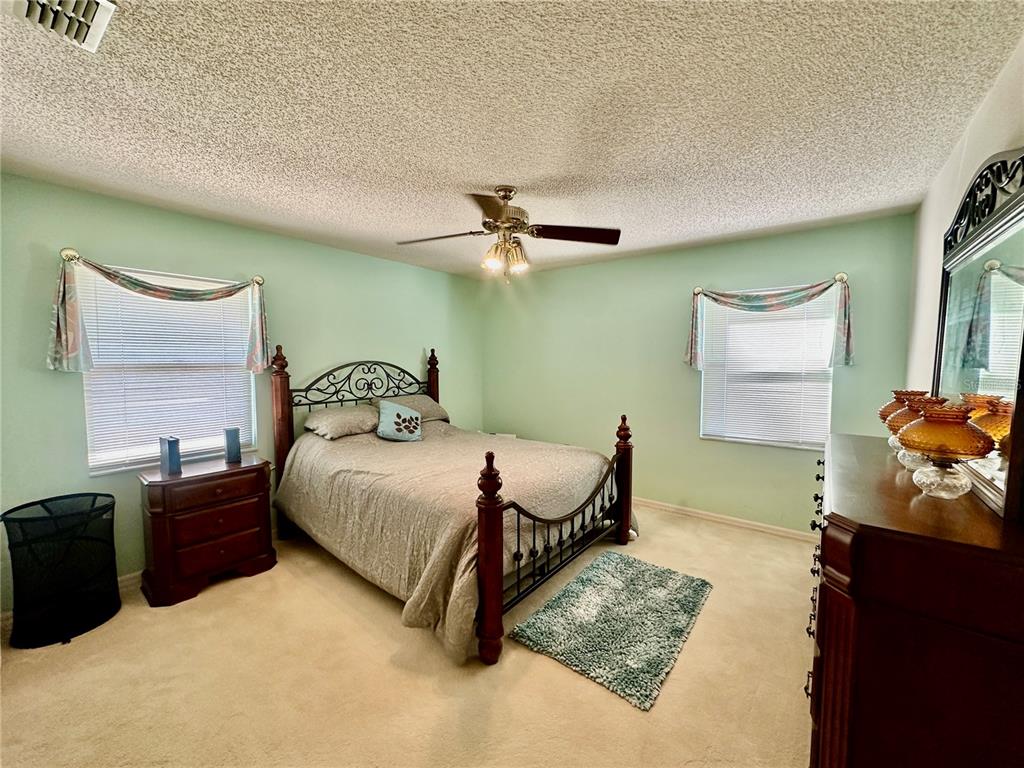 262 Santa Rosa Drive Winter Haven, FL 33884 - Photo 24 of 40 a bedroom with a bed dresser and window