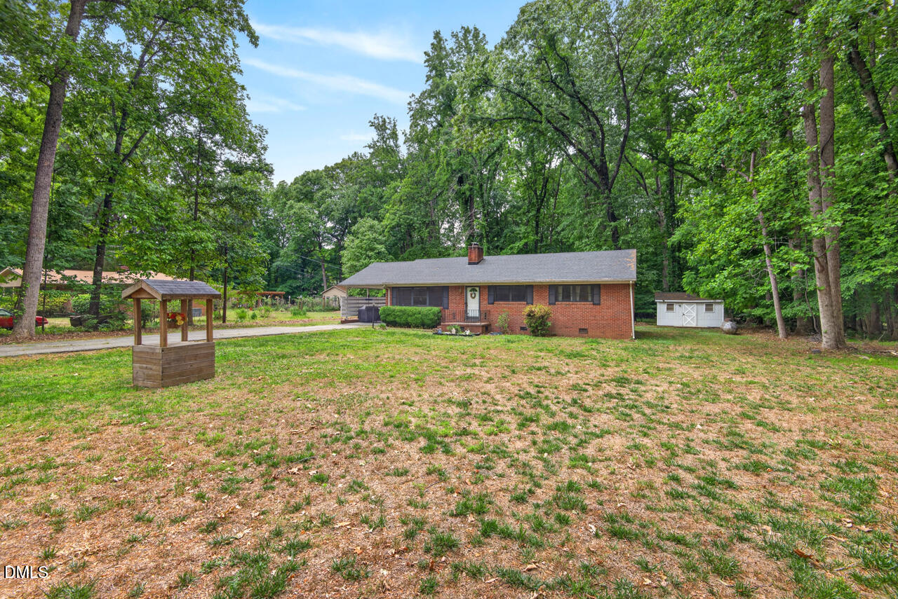1420 Goodwin Road Durham, NC 27712 - Photo 53 of 54 a backyard of a house with table and chairs
