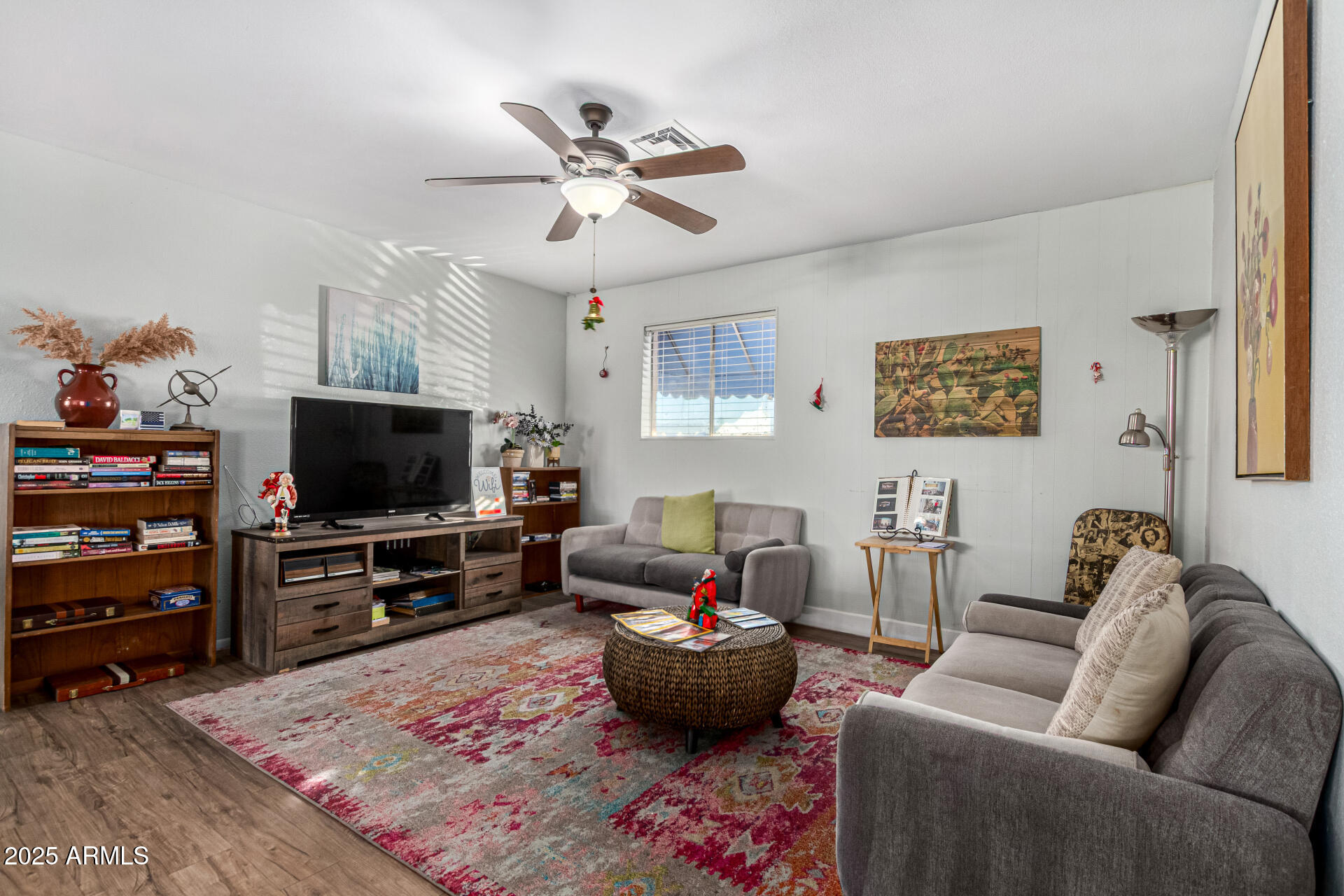16225 North Cave Creek Road, Unit 85 Phoenix, AZ 85032 - Photo 27 of 36 a living room with furniture and a flat screen tv