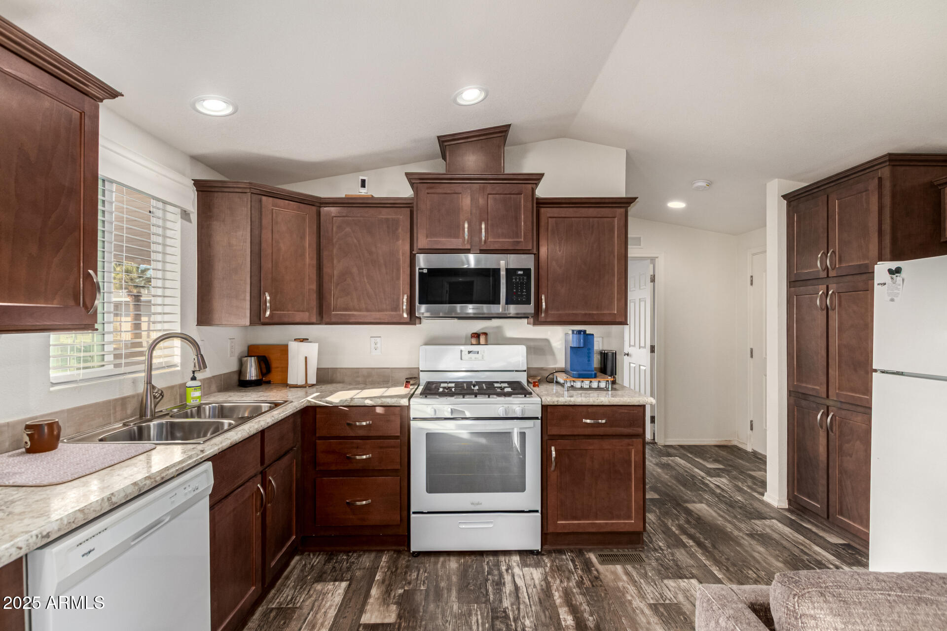 16225 North Cave Creek Road, Unit 85 Phoenix, AZ 85032 - Photo 3 of 36 a kitchen with a sink stove and refrigerator