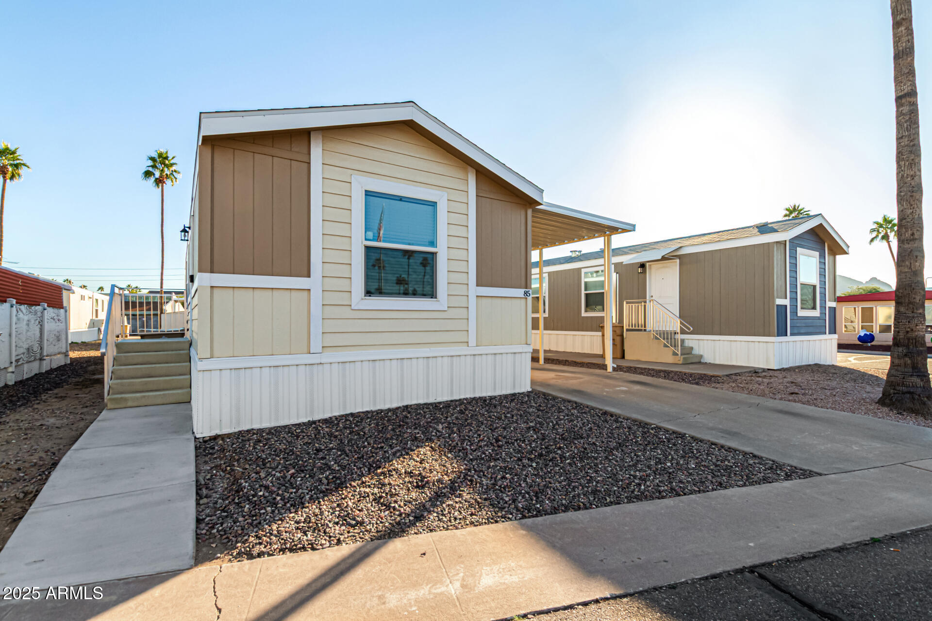 16225 North Cave Creek Road, Unit 85 Phoenix, AZ 85032 - Photo 33 of 36 a front view of a house with a yard