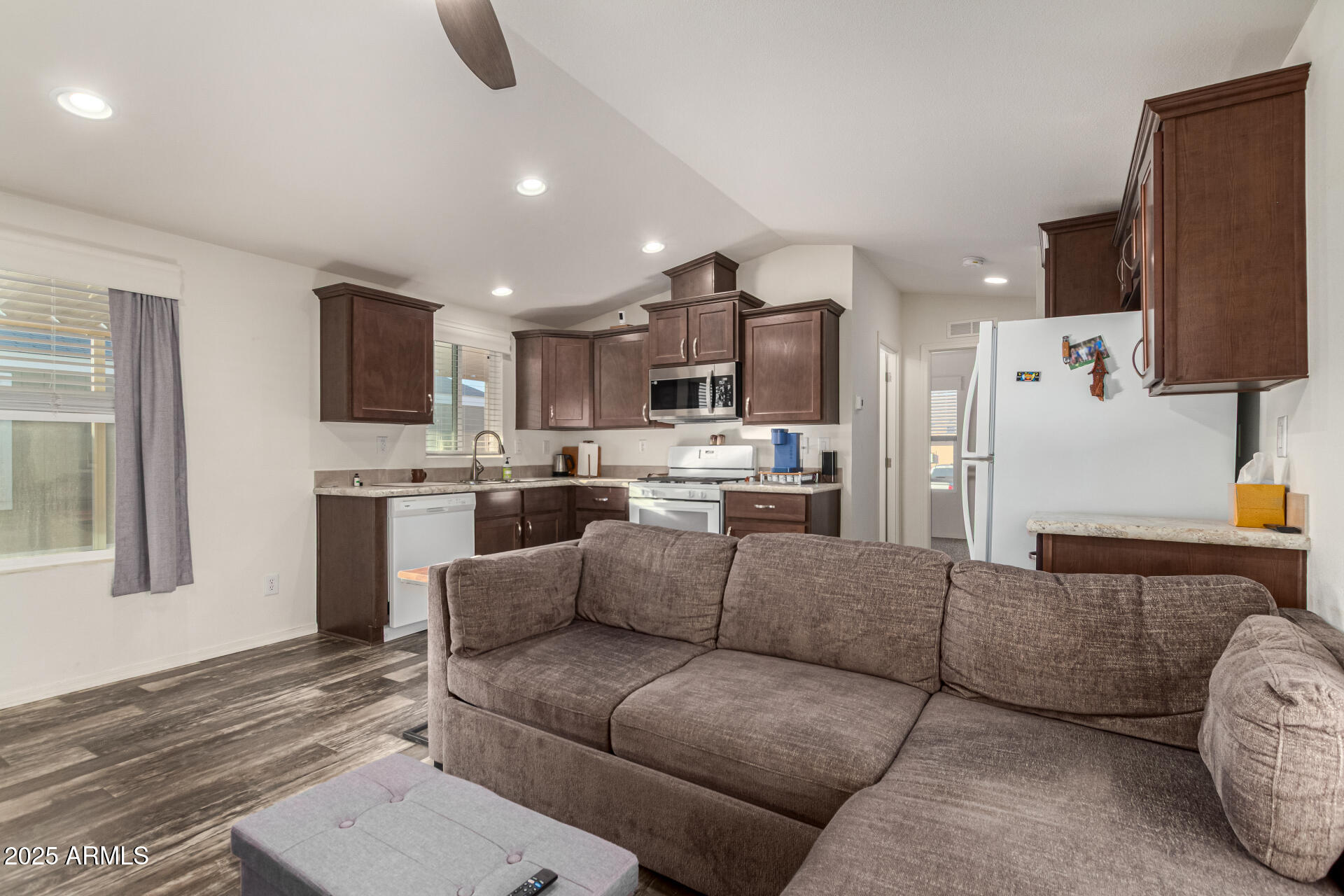 16225 North Cave Creek Road, Unit 85 Phoenix, AZ 85032 - Photo 4 of 36 a living room with furniture and a view of kitchen