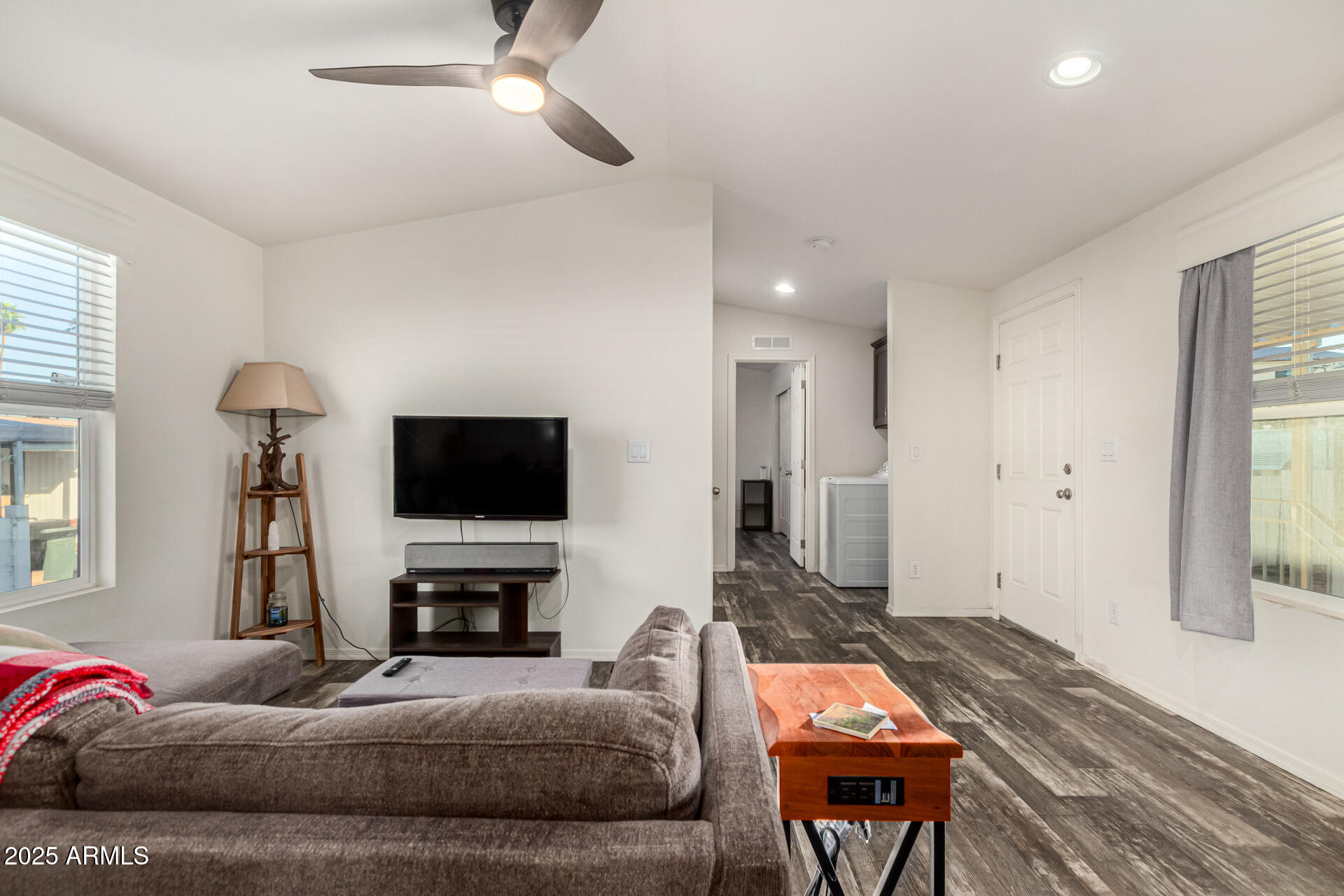 16225 North Cave Creek Road, Unit 85 Phoenix, AZ 85032 - Photo 9 of 36 a living room with furniture a flat screen tv and a fireplace