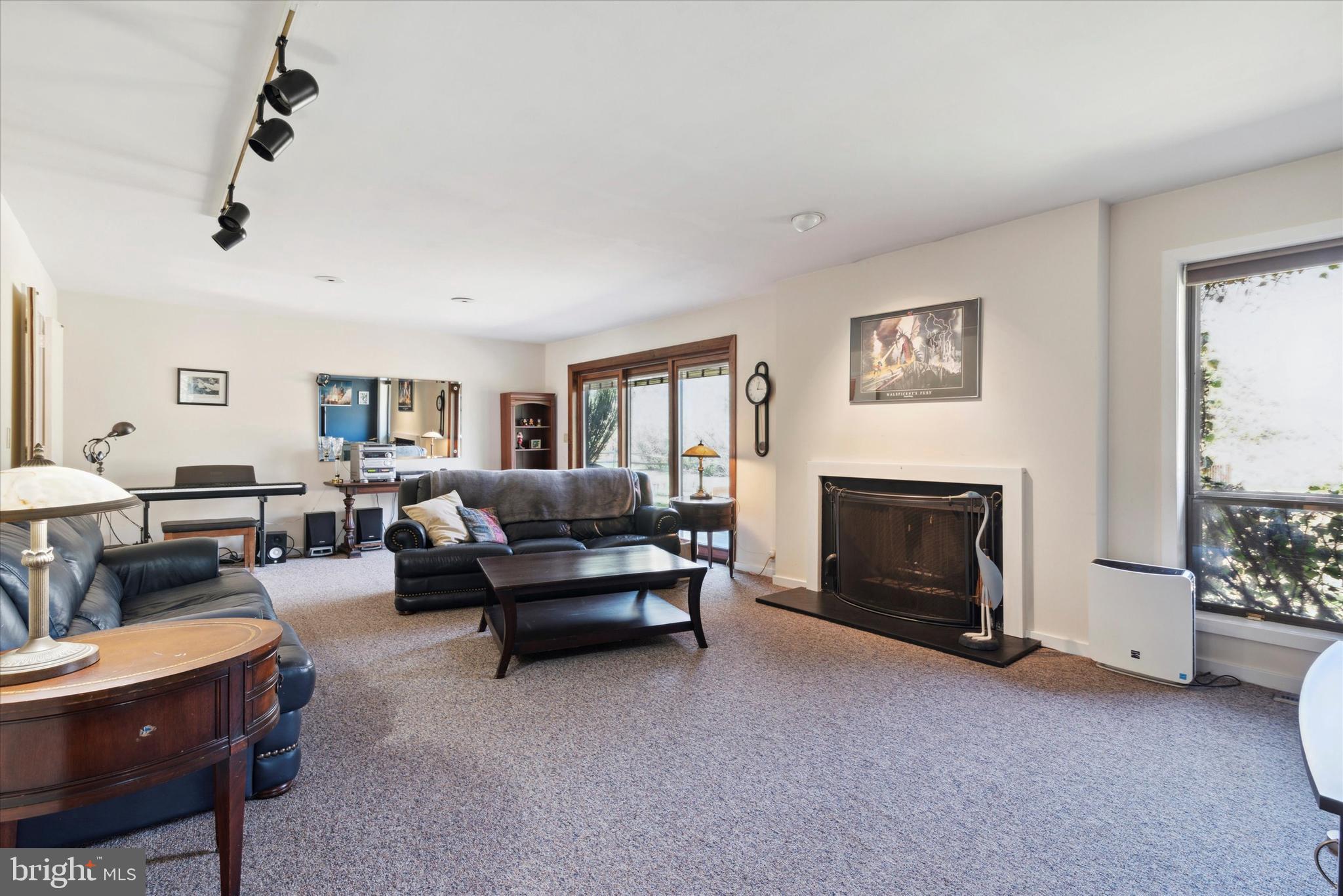 655 Lindley Road Glenside, PA 19038 - Photo 18 of 35 Large living room with wood fireplace.