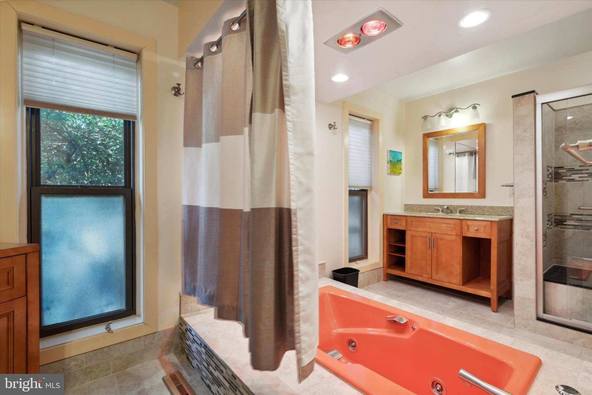 655 Lindley Road Glenside, PA 19038 - Photo 23 of 35 Primary bathroom, soaking tub & tiled shower.