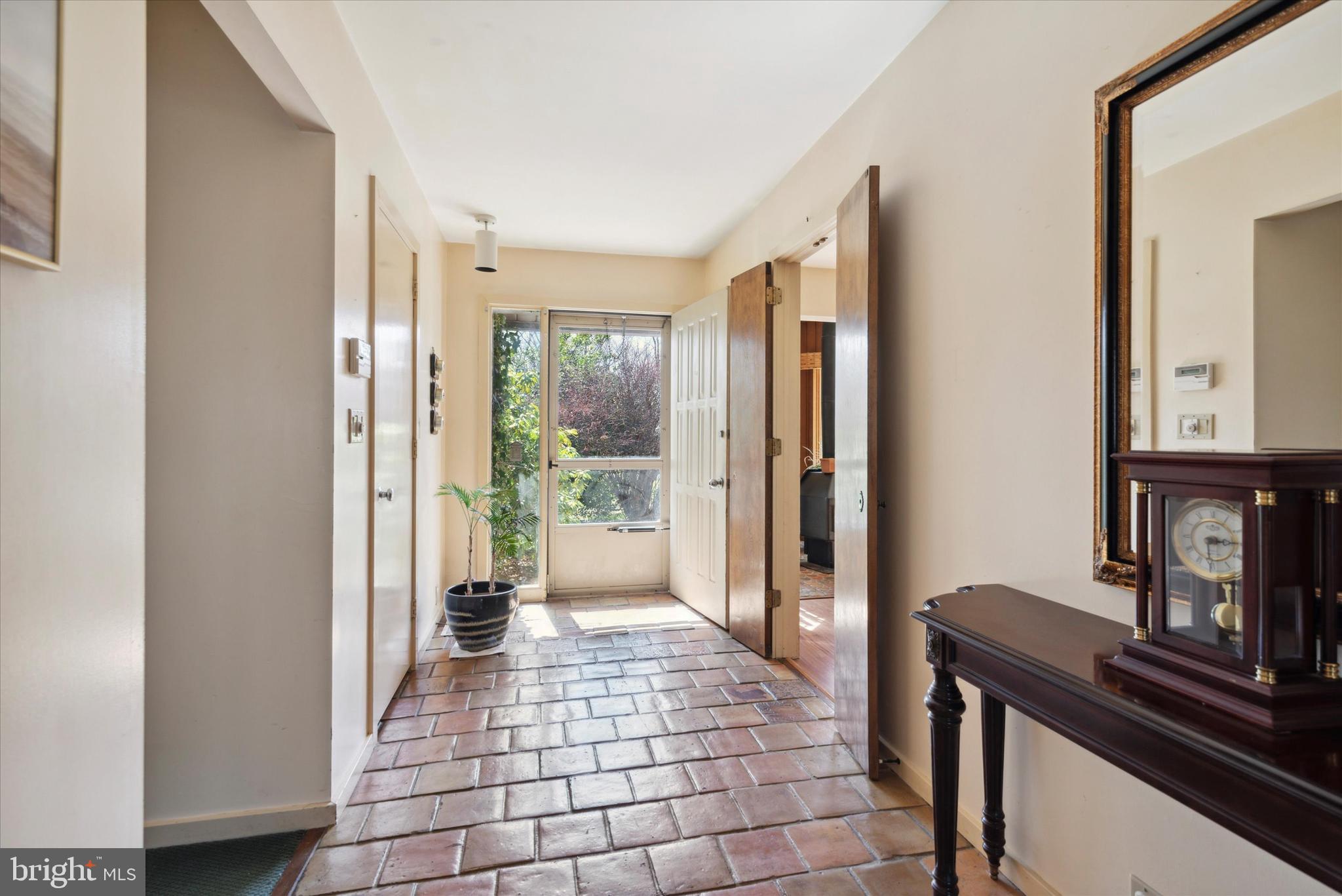 655 Lindley Road Glenside, PA 19038 - Photo 9 of 35 Front door entrance has beautiful terracotta tile