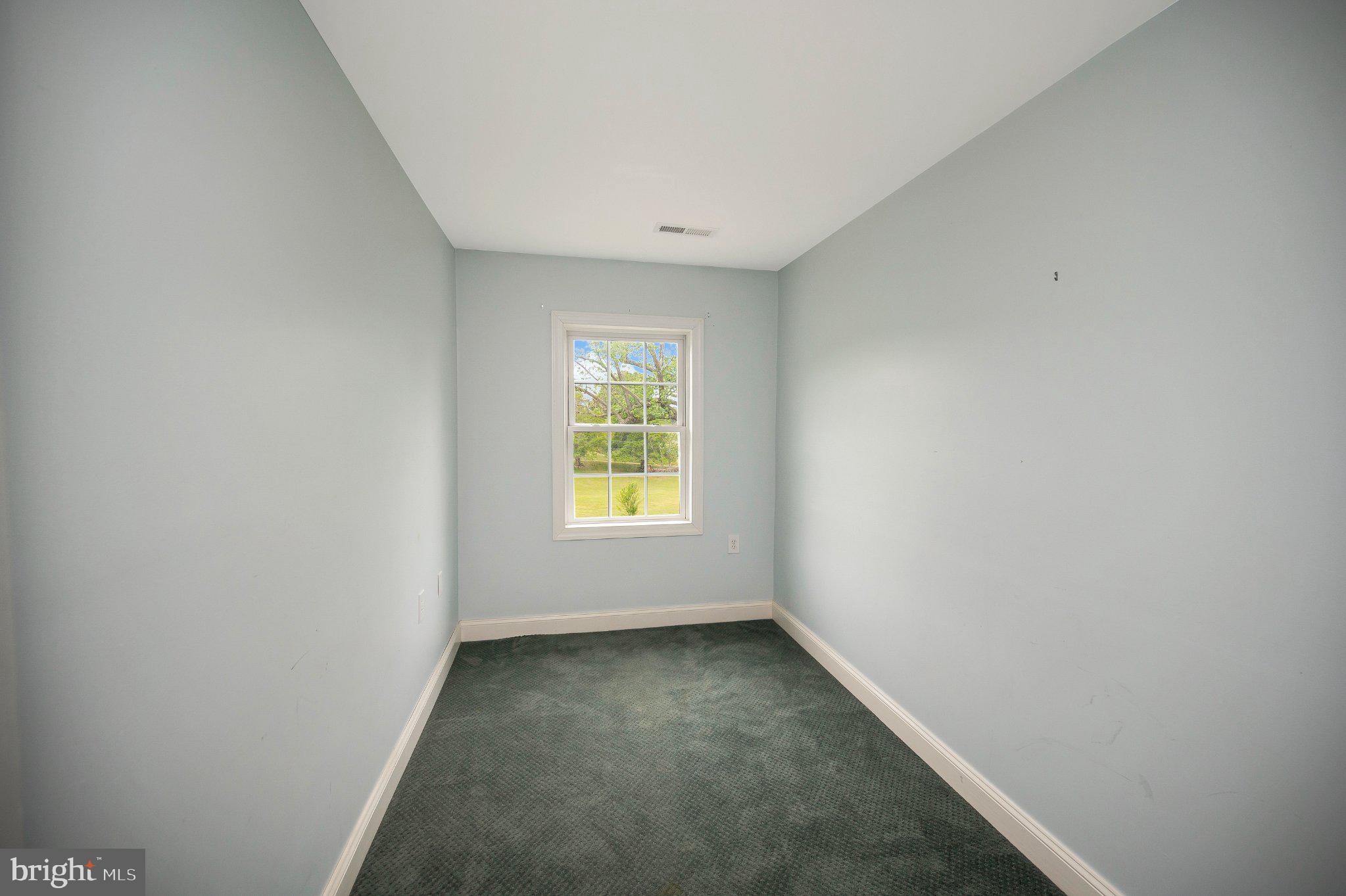 23202 Village Road Unionville, VA 22567 - Photo 39 of 58 an empty room with a window