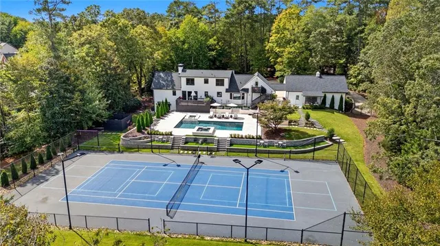 a bathroom with a double vanity sink mirror and toilet