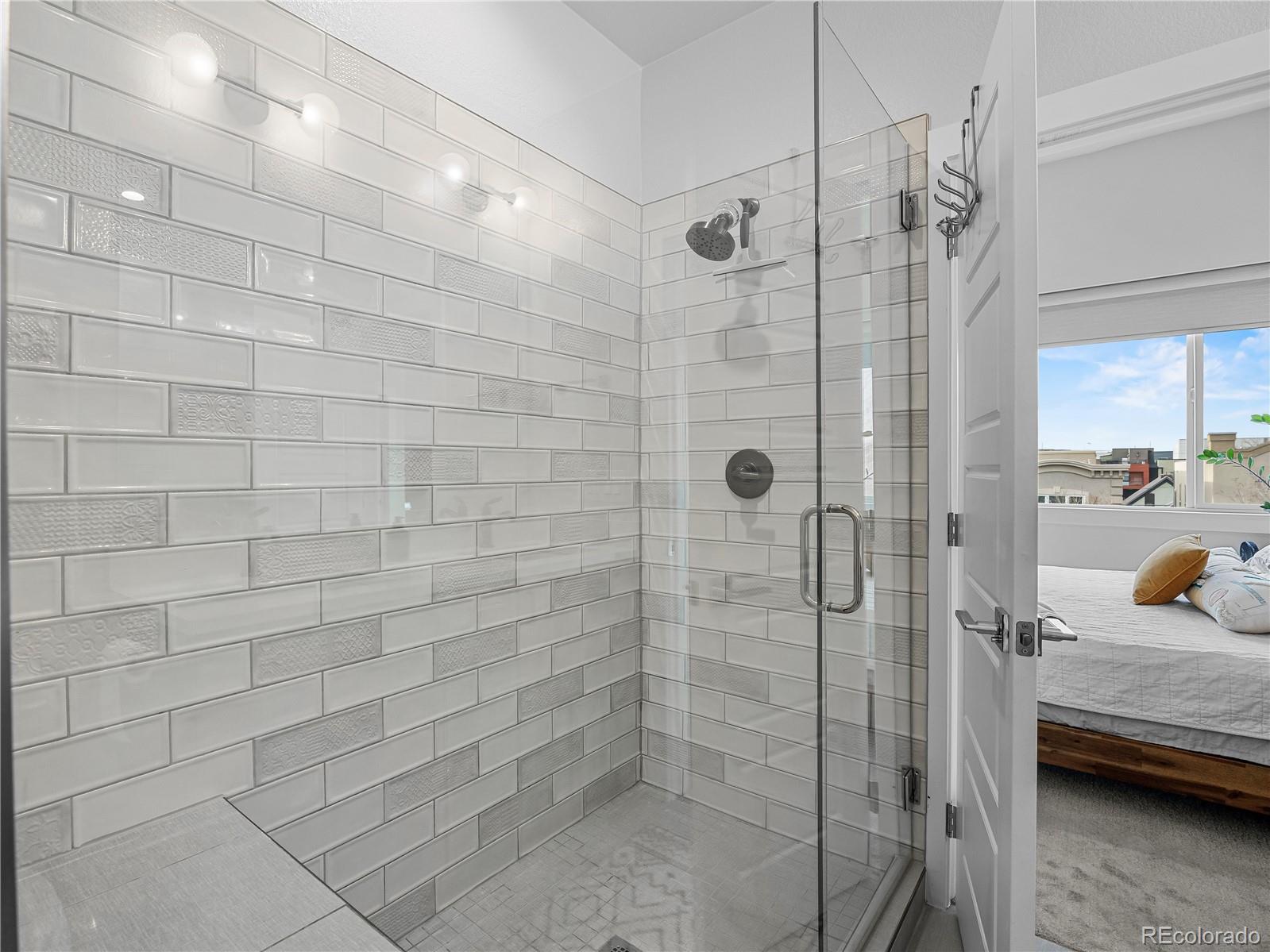 2350 Tremont Place, Unit 6 Denver, CO 80205 - Photo 26 of 40 a bathroom with a shower and a sink