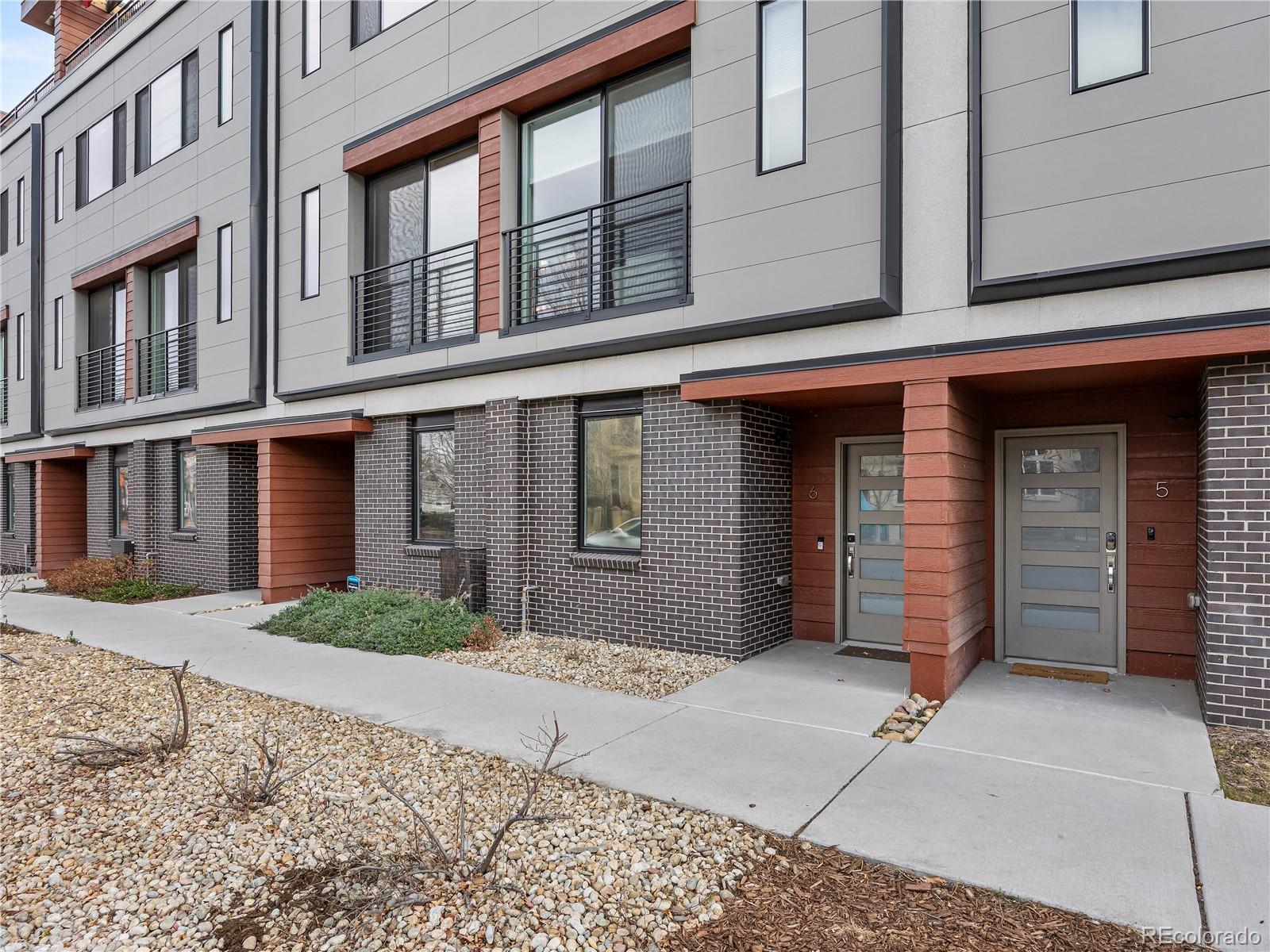 2350 Tremont Place, Unit 6 Denver, CO 80205 - Photo 3 of 40 a front view of a brick building