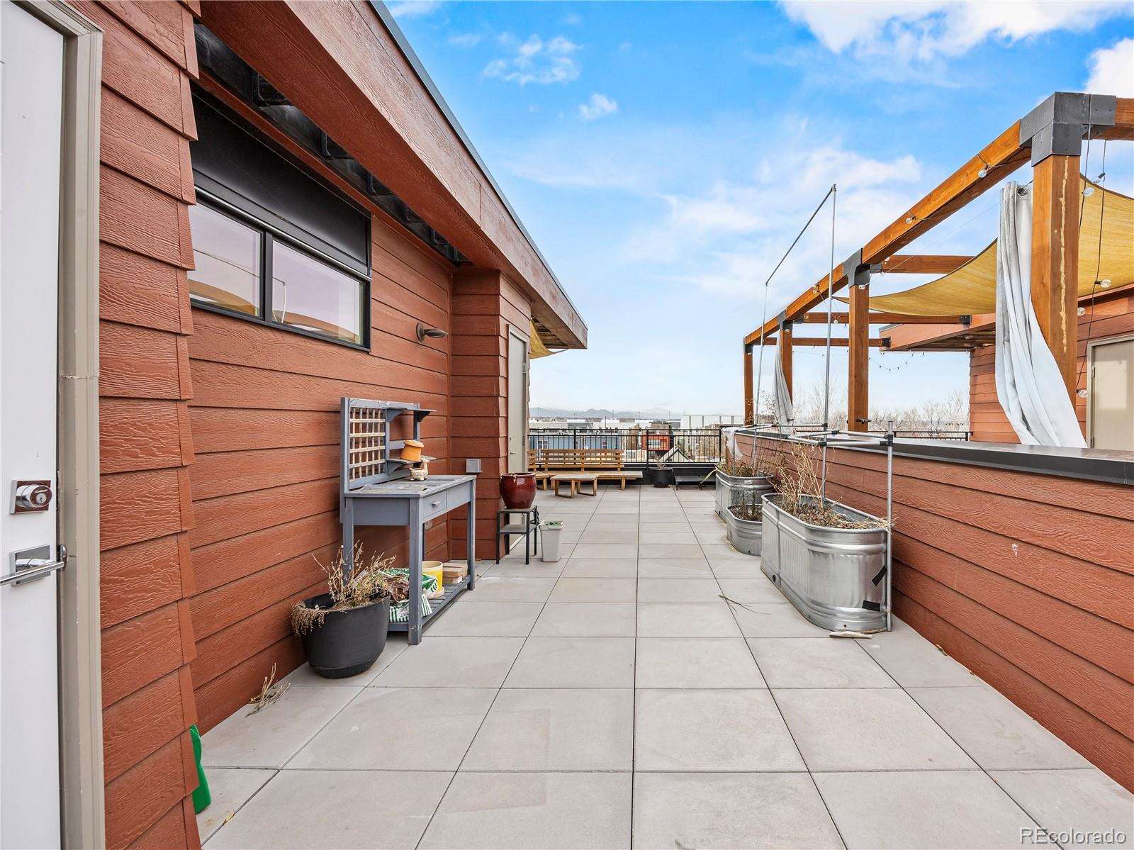 2350 Tremont Place, Unit 6 Denver, CO 80205 - Photo 32 of 40 a view of a chairs and tables in the balcony