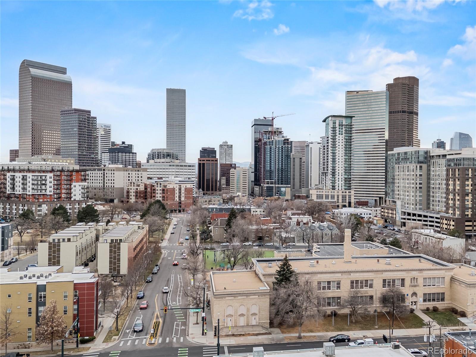 2350 Tremont Place, Unit 6 Denver, CO 80205 - Photo 40 of 40 a large building with a city view