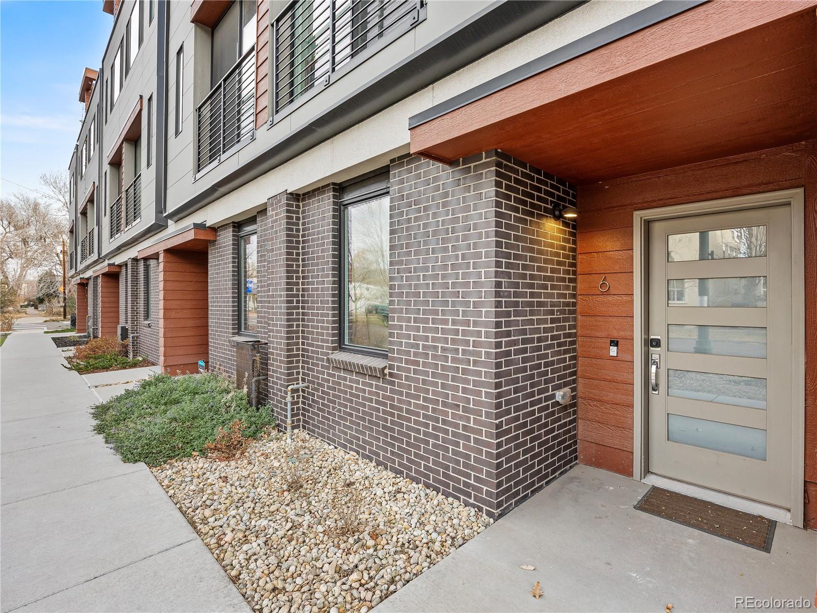 2350 Tremont Place, Unit 6 Denver, CO 80205 - Photo 5 of 40 a view of a pathway along the building