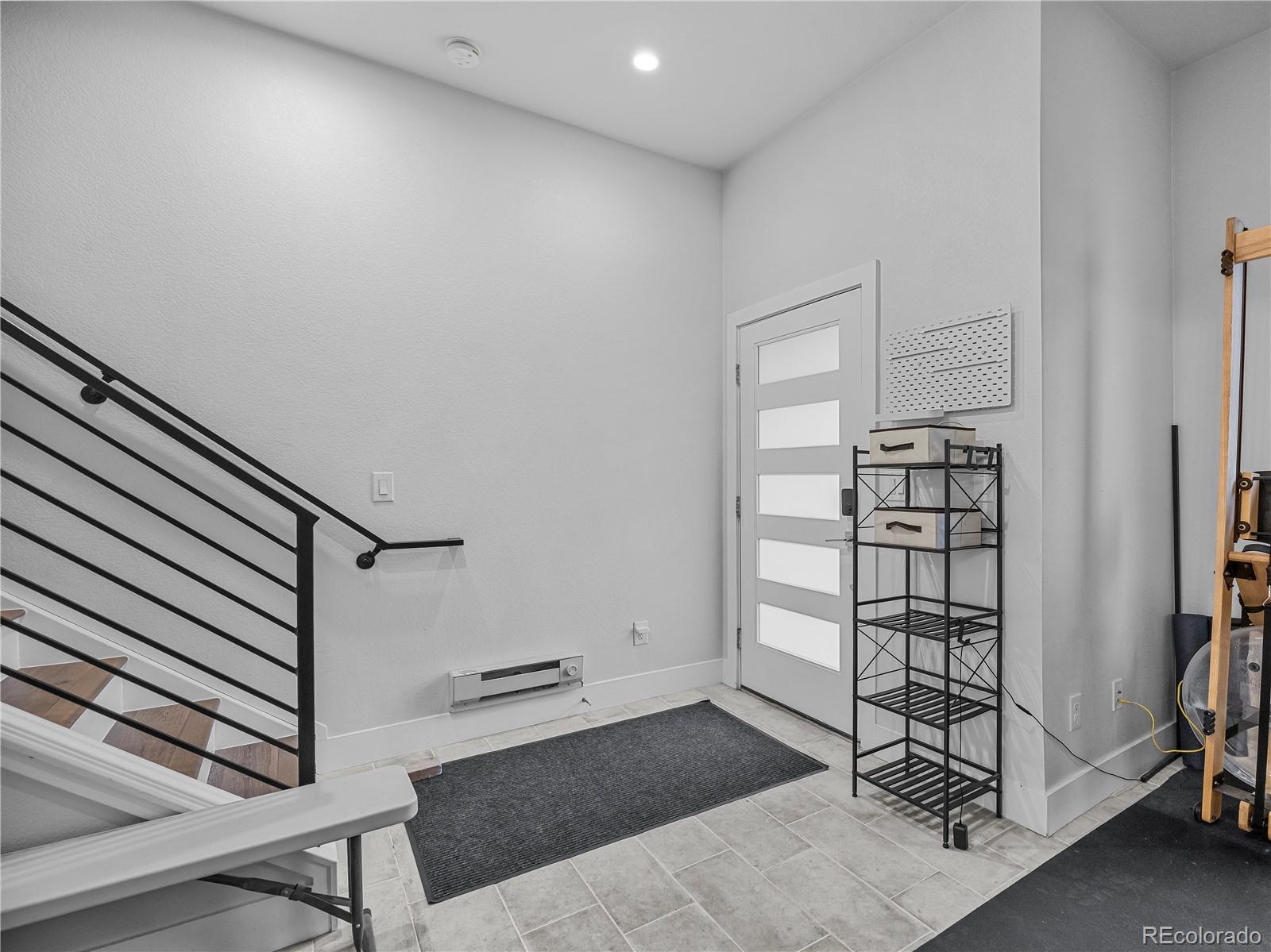 2350 Tremont Place, Unit 6 Denver, CO 80205 - Photo 6 of 40 a view of a hallway with wooden floor and entryway