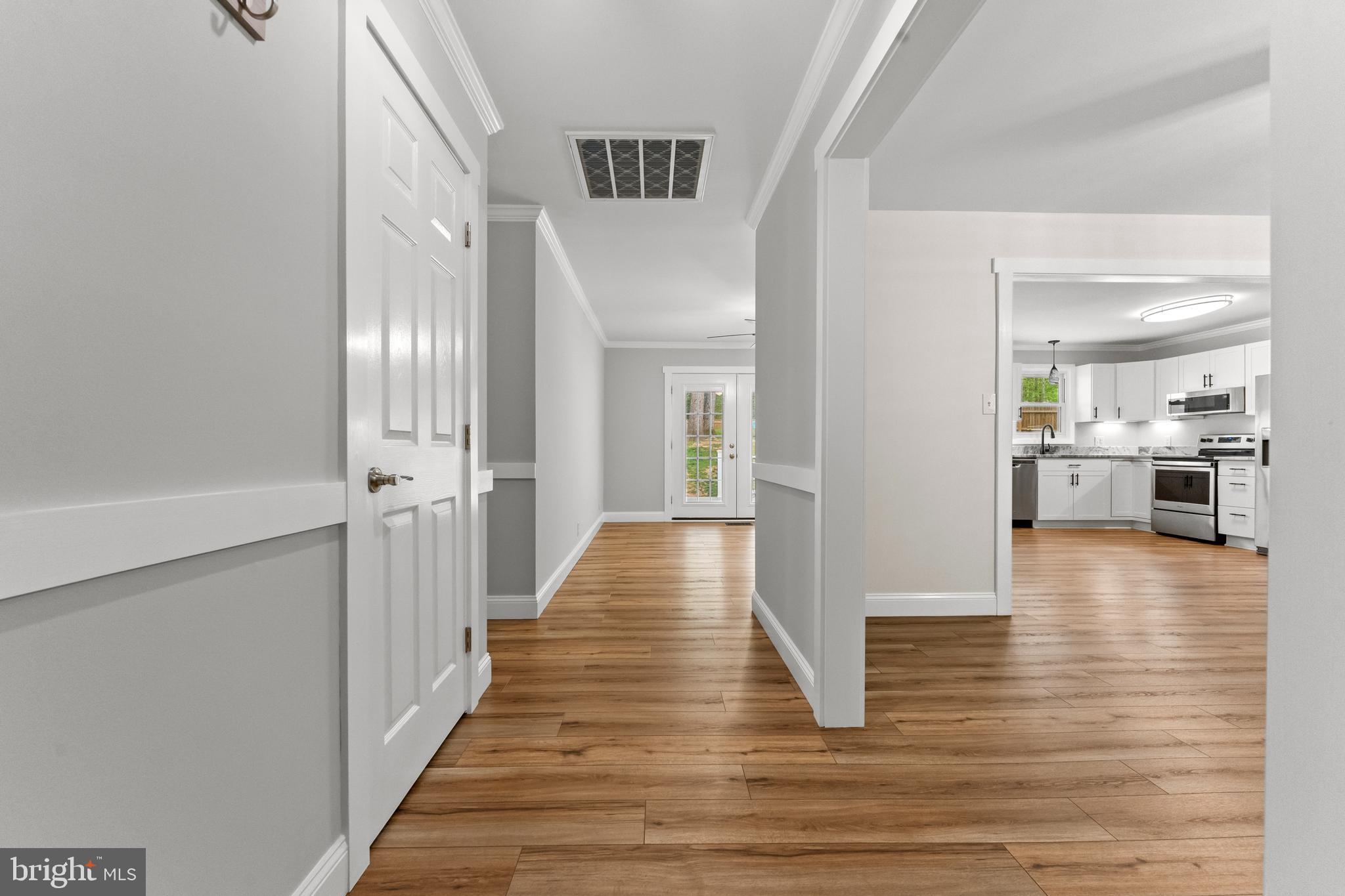 8 Colyer Road Fredericksburg, VA 22406 - Photo 11 of 56 a view of a hallway view with wooden floor and kitchen view