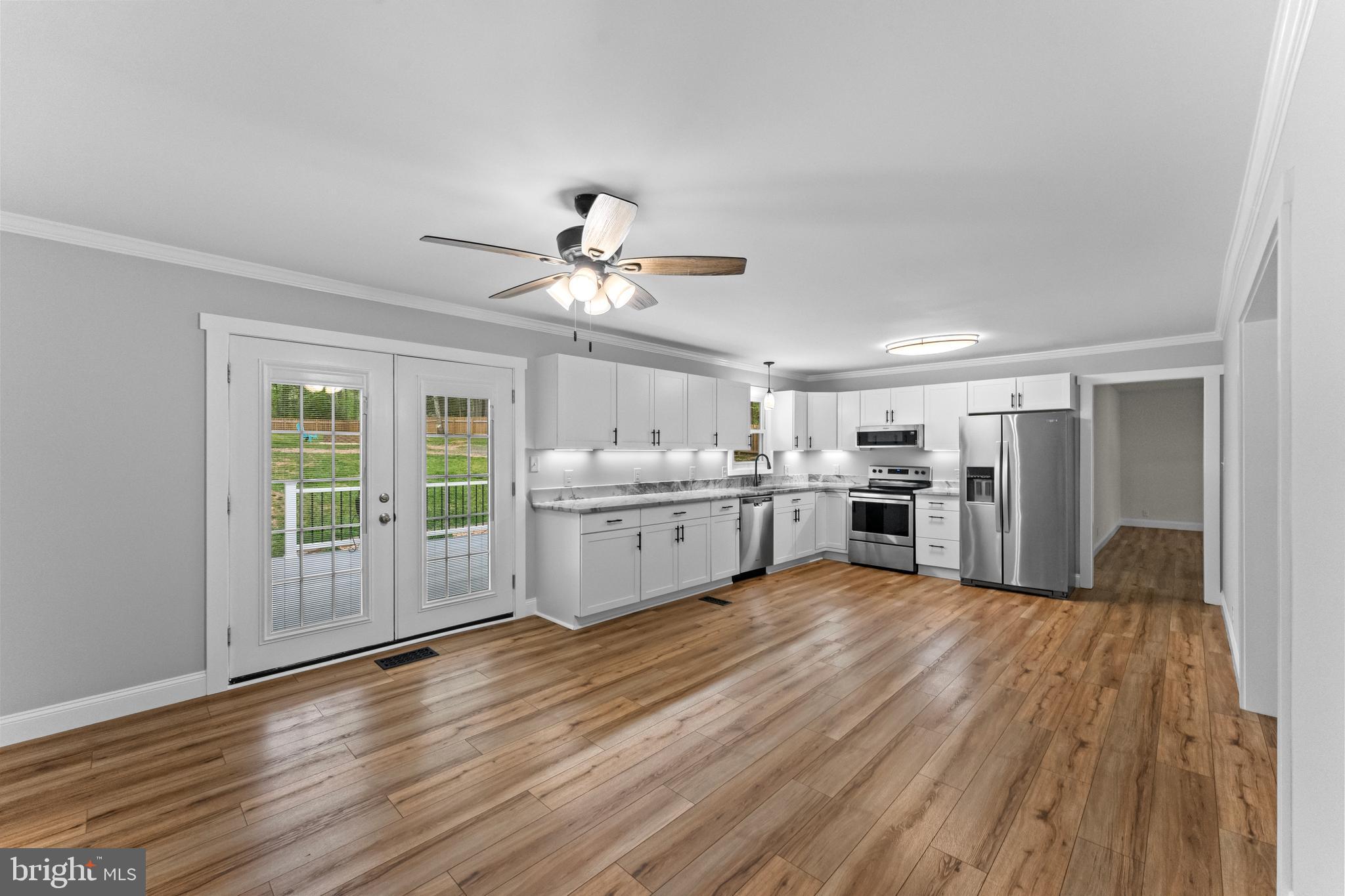 8 Colyer Road Fredericksburg, VA 22406 - Photo 20 of 56 a view of a kitchen with wooden floor and electronic appliances