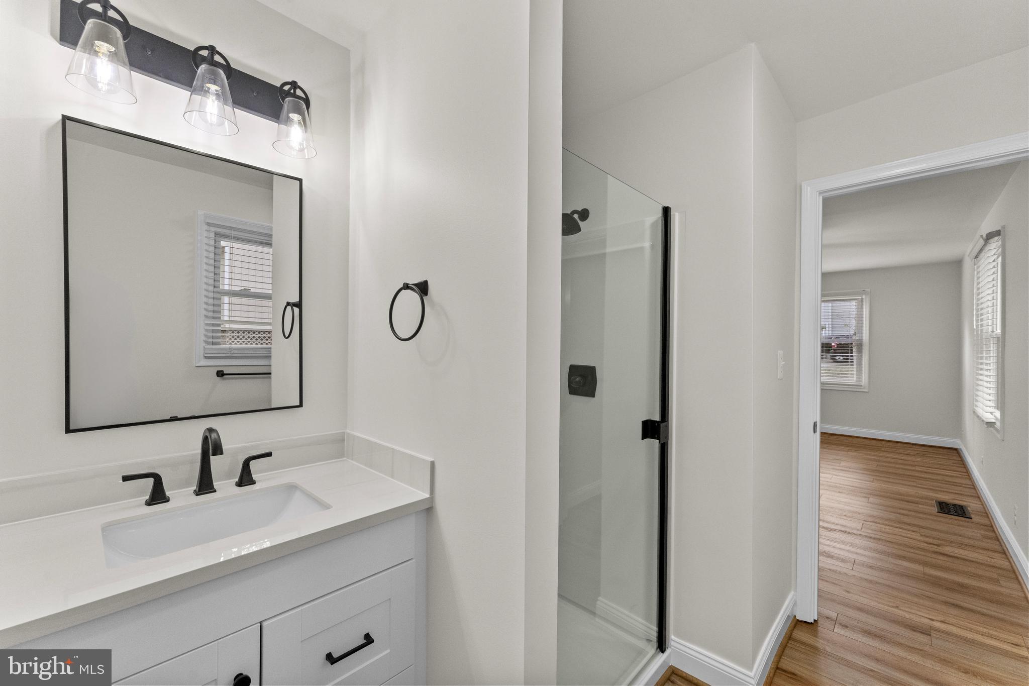 8 Colyer Road Fredericksburg, VA 22406 - Photo 30 of 56 a bathroom with a double vanity sink and mirror