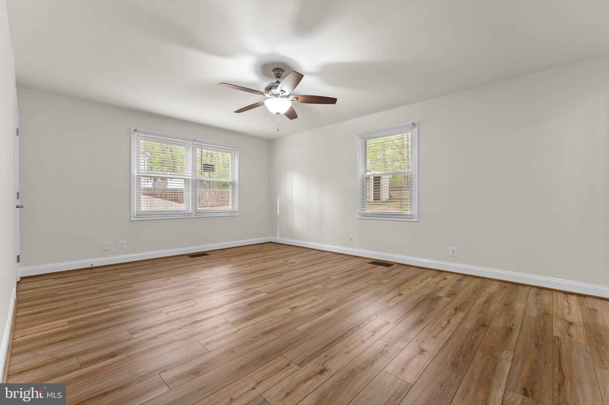 8 Colyer Road Fredericksburg, VA 22406 - Photo 31 of 56 a view of an empty room with a window and wooden floor