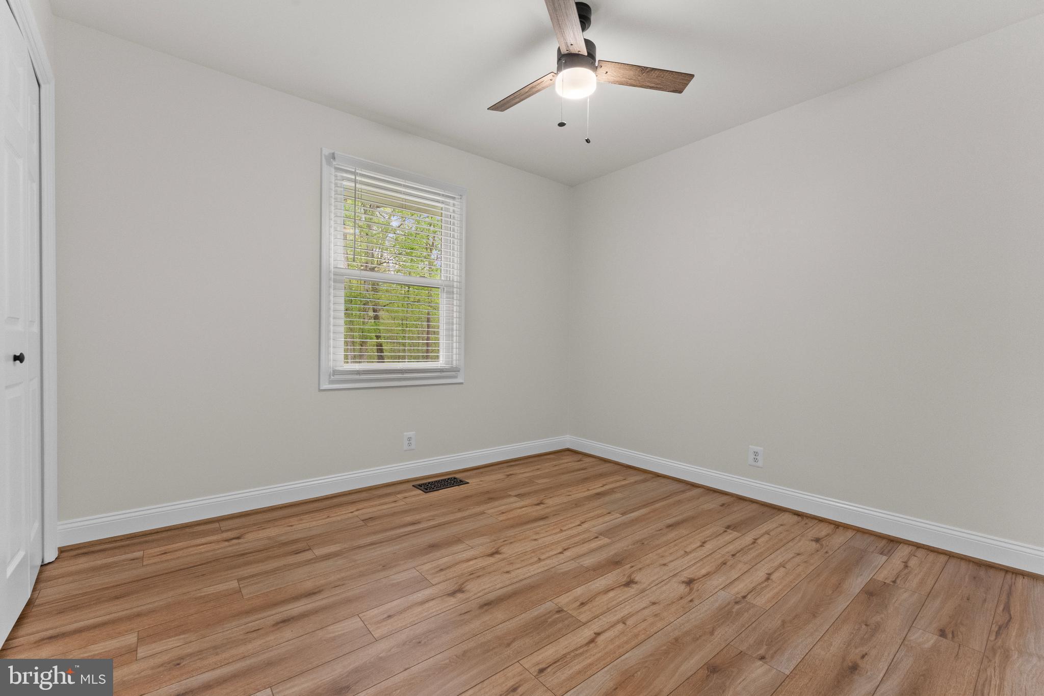 8 Colyer Road Fredericksburg, VA 22406 - Photo 37 of 56 wooden floor in an empty room with a window