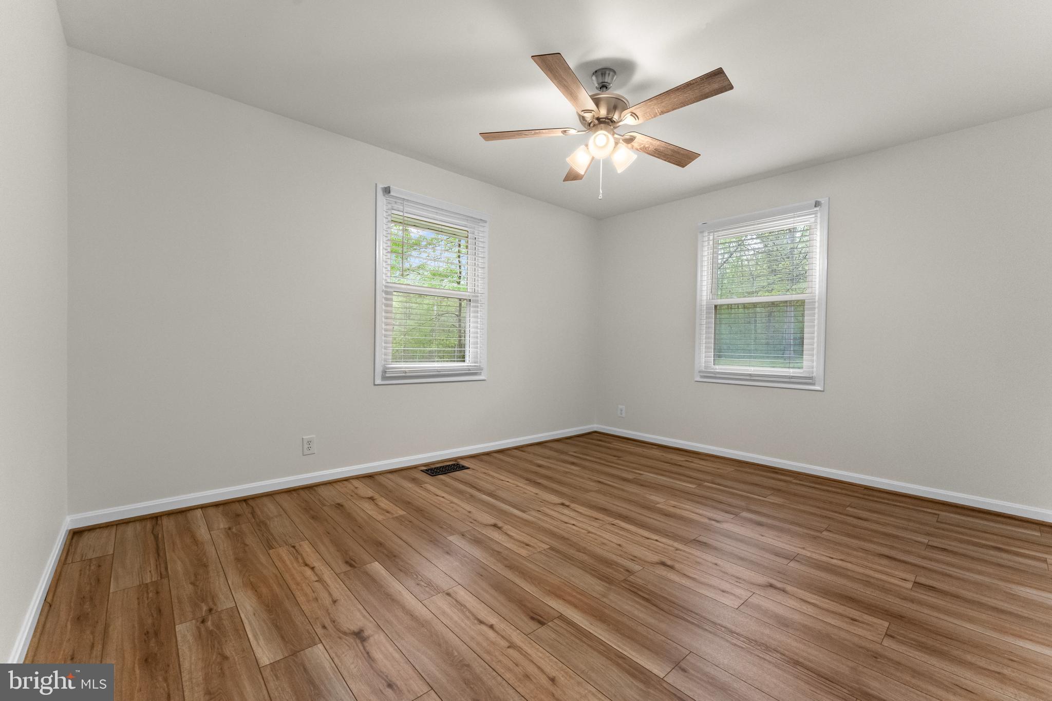 8 Colyer Road Fredericksburg, VA 22406 - Photo 39 of 56 a view of an empty room with wooden floor and a window