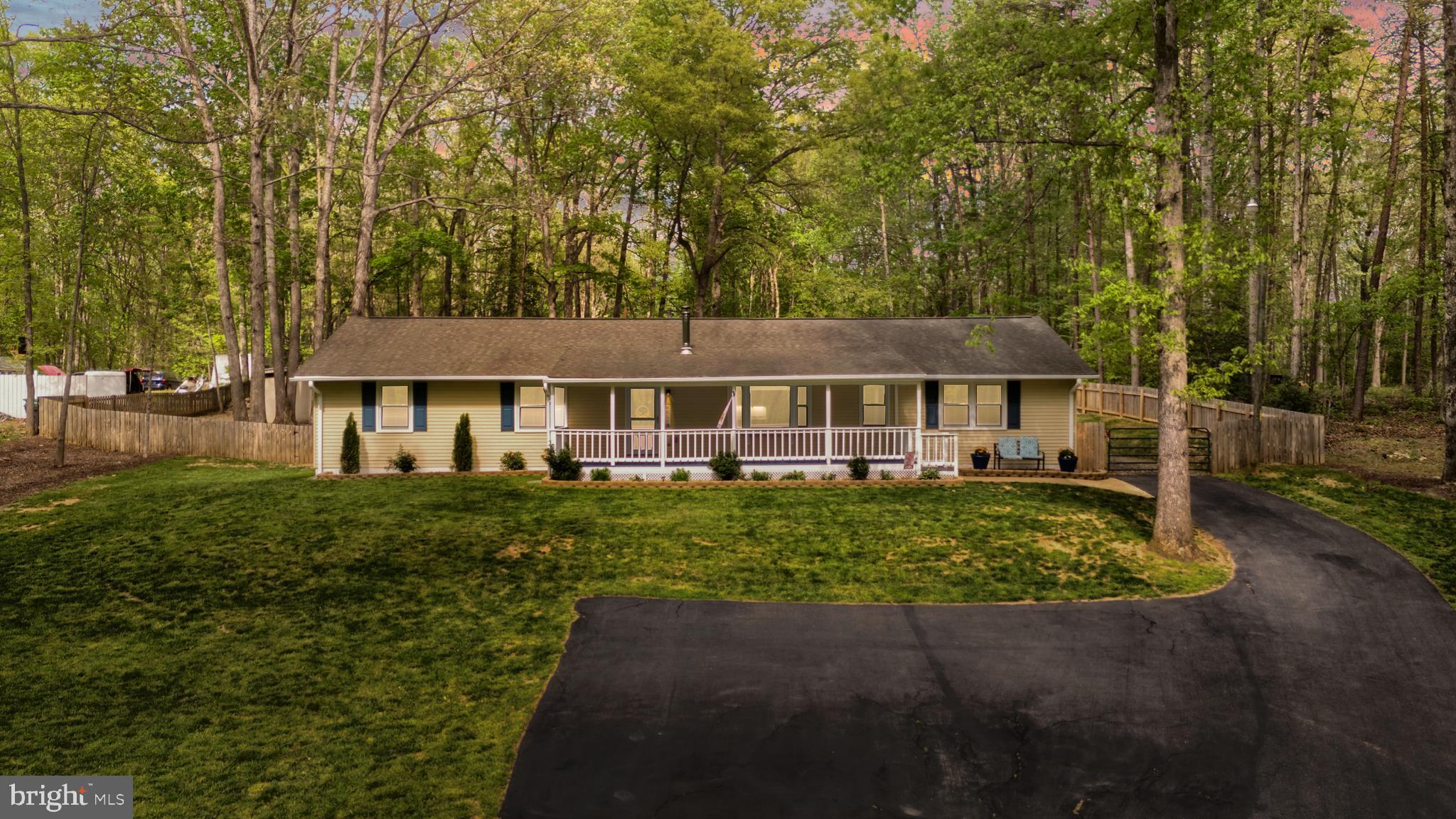 8 Colyer Road Fredericksburg, VA 22406 - Photo 4 of 56 a front view of a house with a garden