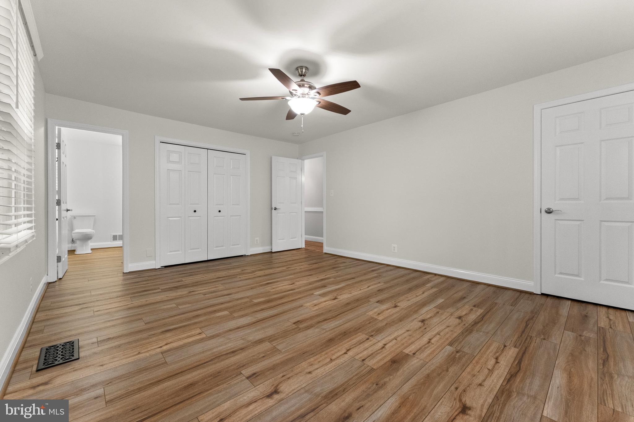 8 Colyer Road Fredericksburg, VA 22406 - Photo 44 of 56 wooden floor in an empty room with a window