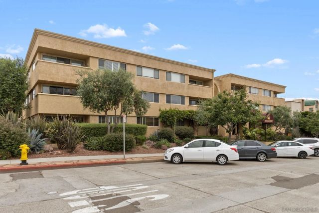 a view of a car parked in front of a building