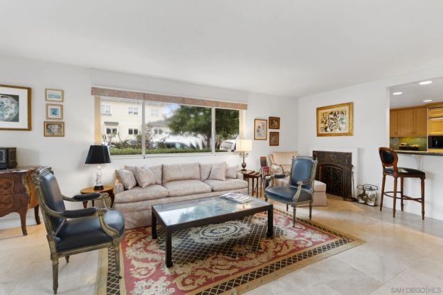 a living room with furniture couches and a flat screen tv