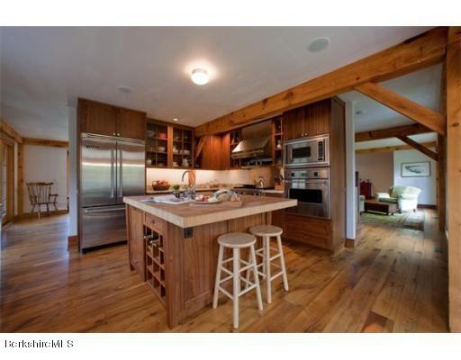 26 S Road Heath, MA 01346 - Photo 8 of 29 a kitchen with stainless steel appliances kitchen island granite countertop a table and chairs