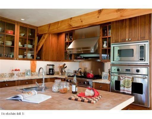 26 S Road Heath, MA 01346 - Photo 9 of 29 a kitchen with stainless steel appliances kitchen island granite countertop a stove and cabinets