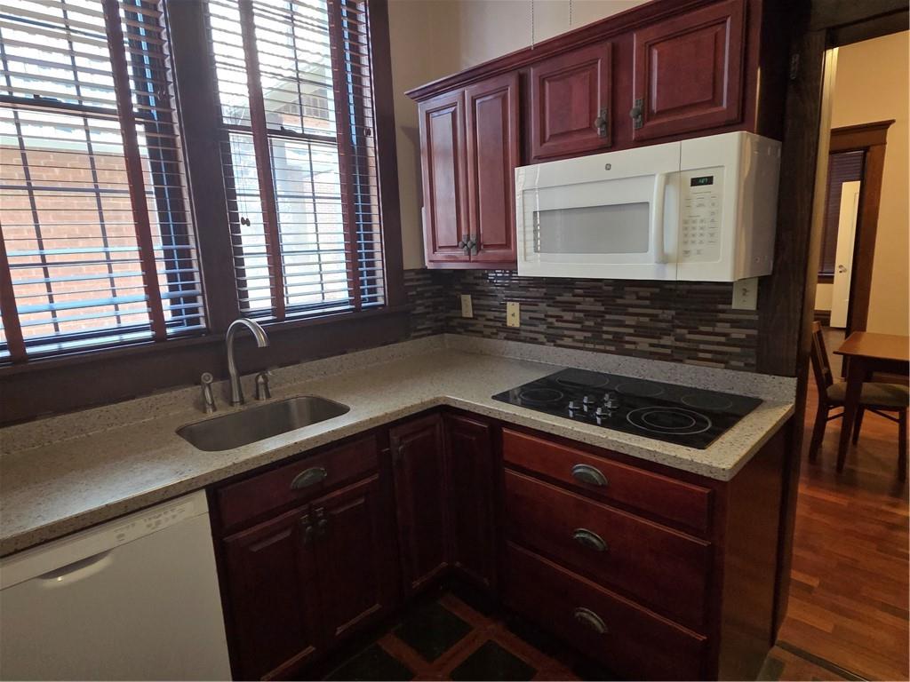 701 4th Street, Unit 2 Pittsburgh, PA 15215 - Photo 14 of 24 a kitchen with granite countertop a sink stove and cabinets